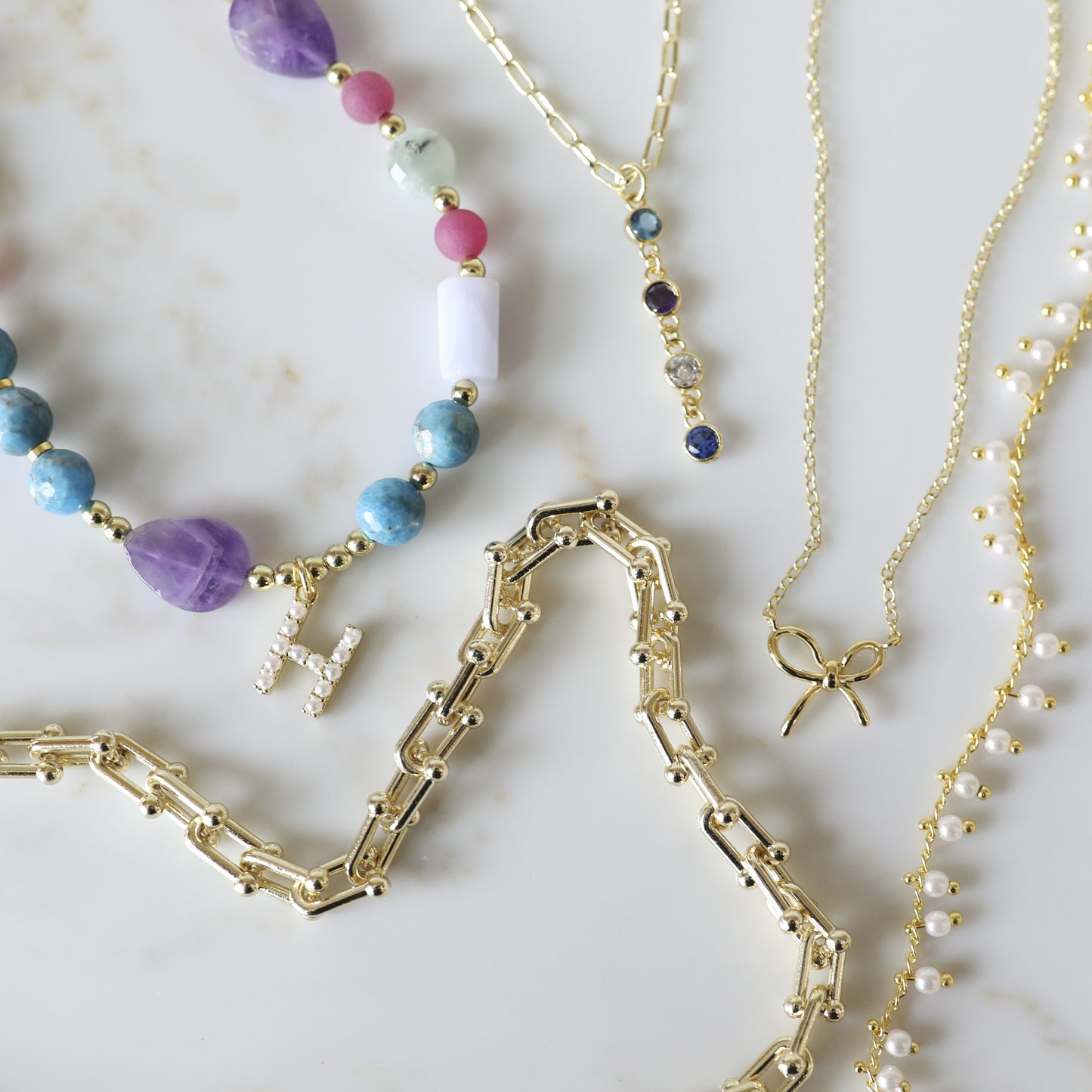 The Mini Birthstone Drop Necklace is one of our favorite pieces we launched this summer