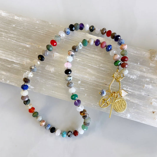 Free Spirit Gemstone Necklace has Tiger Eye, Amethyst, Sodalite, Onyx, Carnelian, Jasper, Turquoise beads plus much more!  To make it extra unique it has a pave clasp in the front to hang charms from, and you can switch the charms on and off!