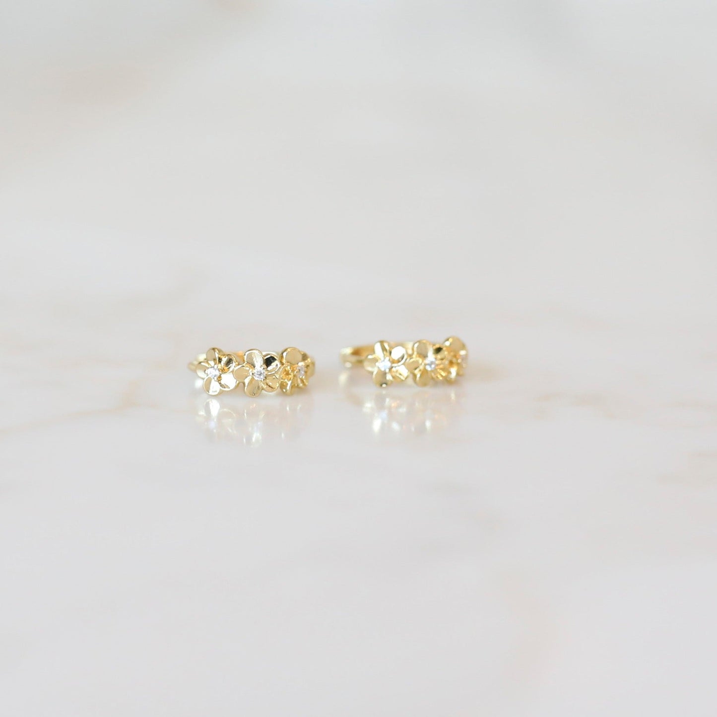Gold flower huggie hoop earrings