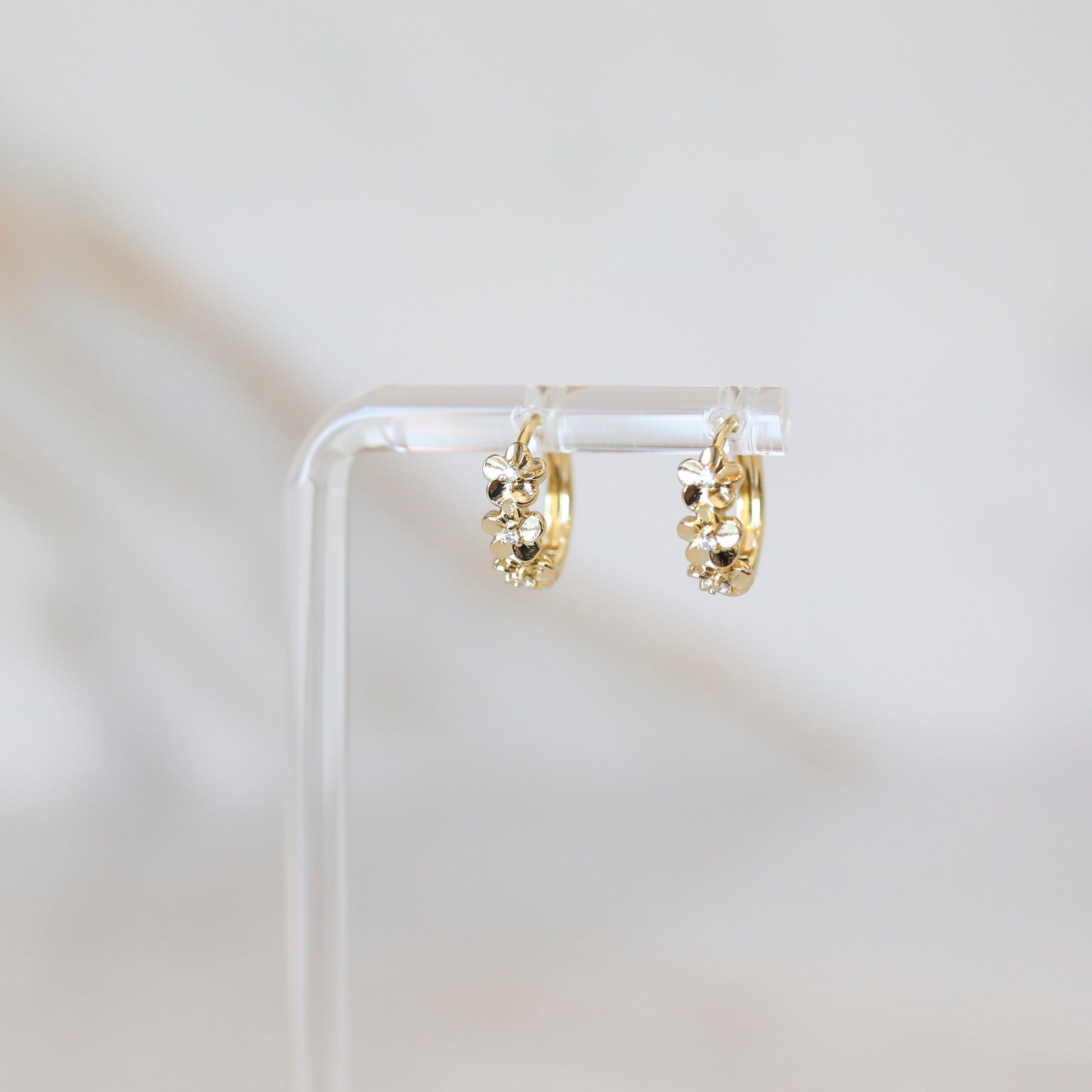 Gold flower huggie hoop earrings