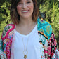 Alex is wearing the Memory Flower Diamond Hoop Charm Necklace -long  gold necklace using pink flowers with charms dangling >